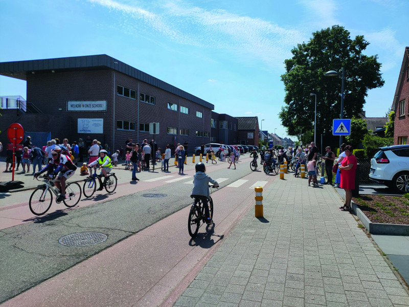 Children using school street, on bikes and playing on the street